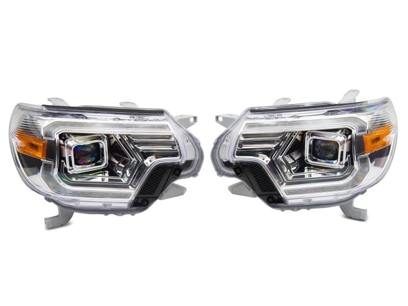 Raxiom Toyota Tacoma axial series switchback projector headlights with chrome finish and clear lenses for 2012-2015 models.