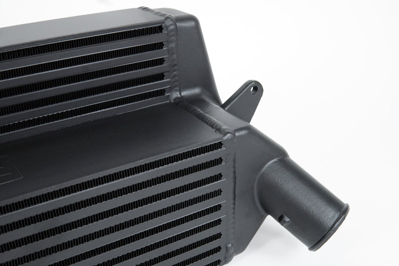 CSF black stepped core intercooler for Hyundai Veloster N and i30 N, showing the sleek metal core and mounting brackets.