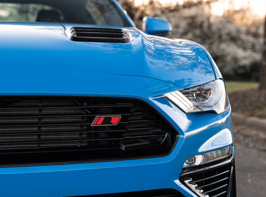 Roush 2018-2023 Mustang hood vents with gloss black heat extractors, designed for improved airflow and aggressive styling.