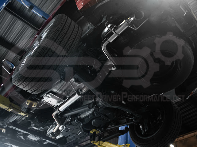 Toyota 4Runner cat-back exhaust system by Street Driven Performance with chrome or burnt blue turn-down tips, showing the polished exhaust pipes.