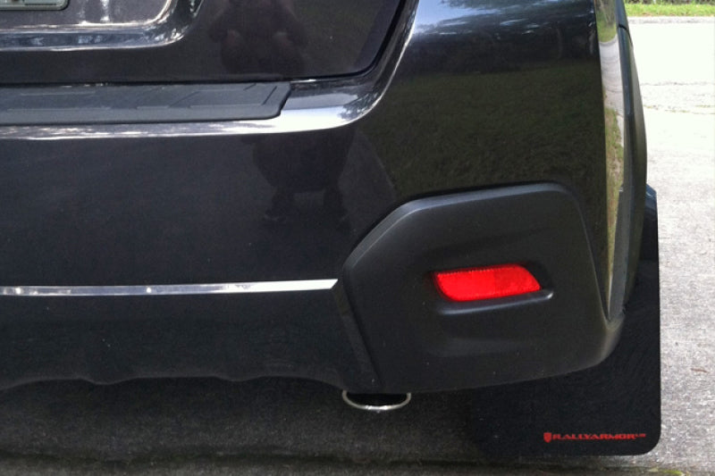 Rally Armor black mud flaps with orange logo for 2013-2017 Subaru Crosstrek XV, durable automotive mud protection.