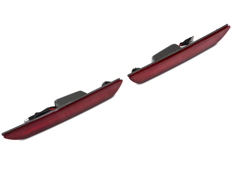 Red Raxiom 15-23 Ford Mustang Axial Series LED rear side marker lights installed on the vehicle.