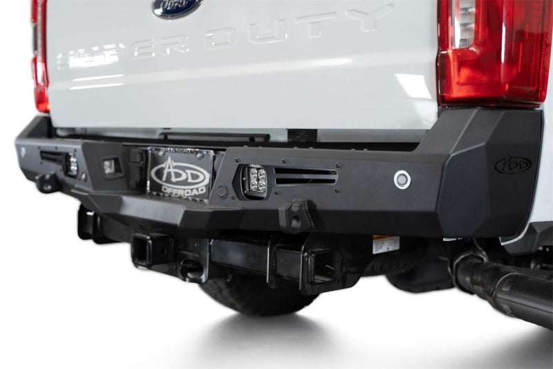Addictive Desert Designs steel bomber rear bumper installed on a 2023-2024 Ford F-150 Super Duty pickup truck.