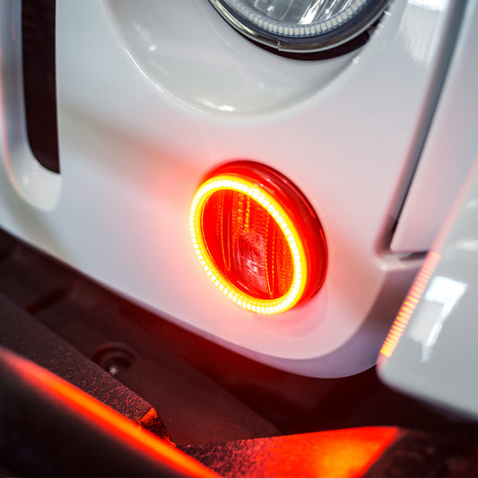 Oracle Lighting Jeep Wrangler 07-17 LED waterproof halo turn signal kit with amber fog light halo rings installed.