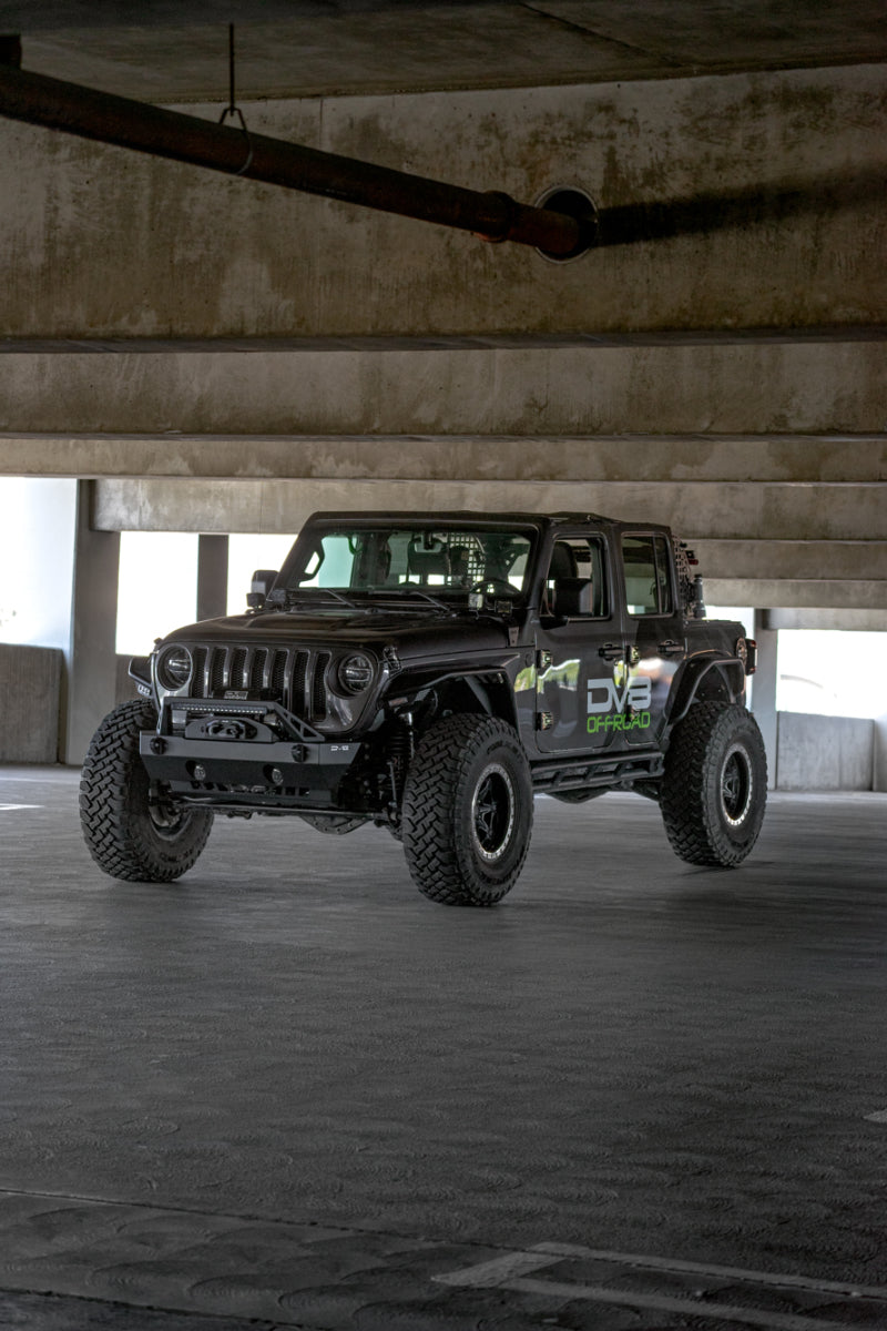 Steel DV8 Offroad FS-25 Stubby front bumper with plated bull bar on a Jeep Wrangler or Gladiator JT/JK/JL, rugged off-road design.