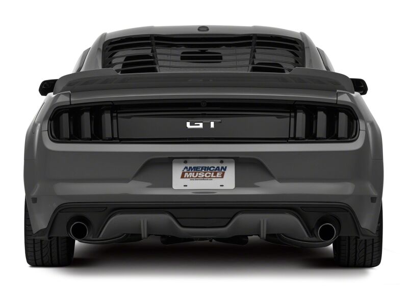 Raxiom Ford Mustang reverse light LED conversion kit with axial series light bars, shown installed on rear of car.