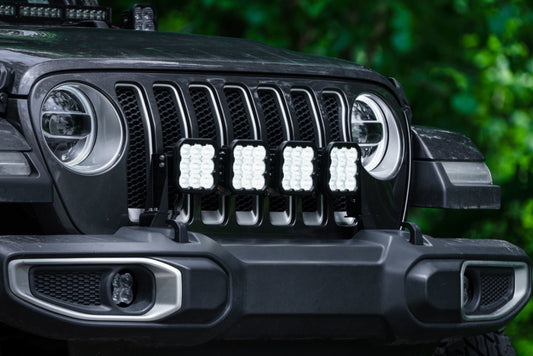 Diode Dynamics Jeep JL SS5 4-Pod CrossLink grille lightbar kit with white LED lights installed on Jeep grille.