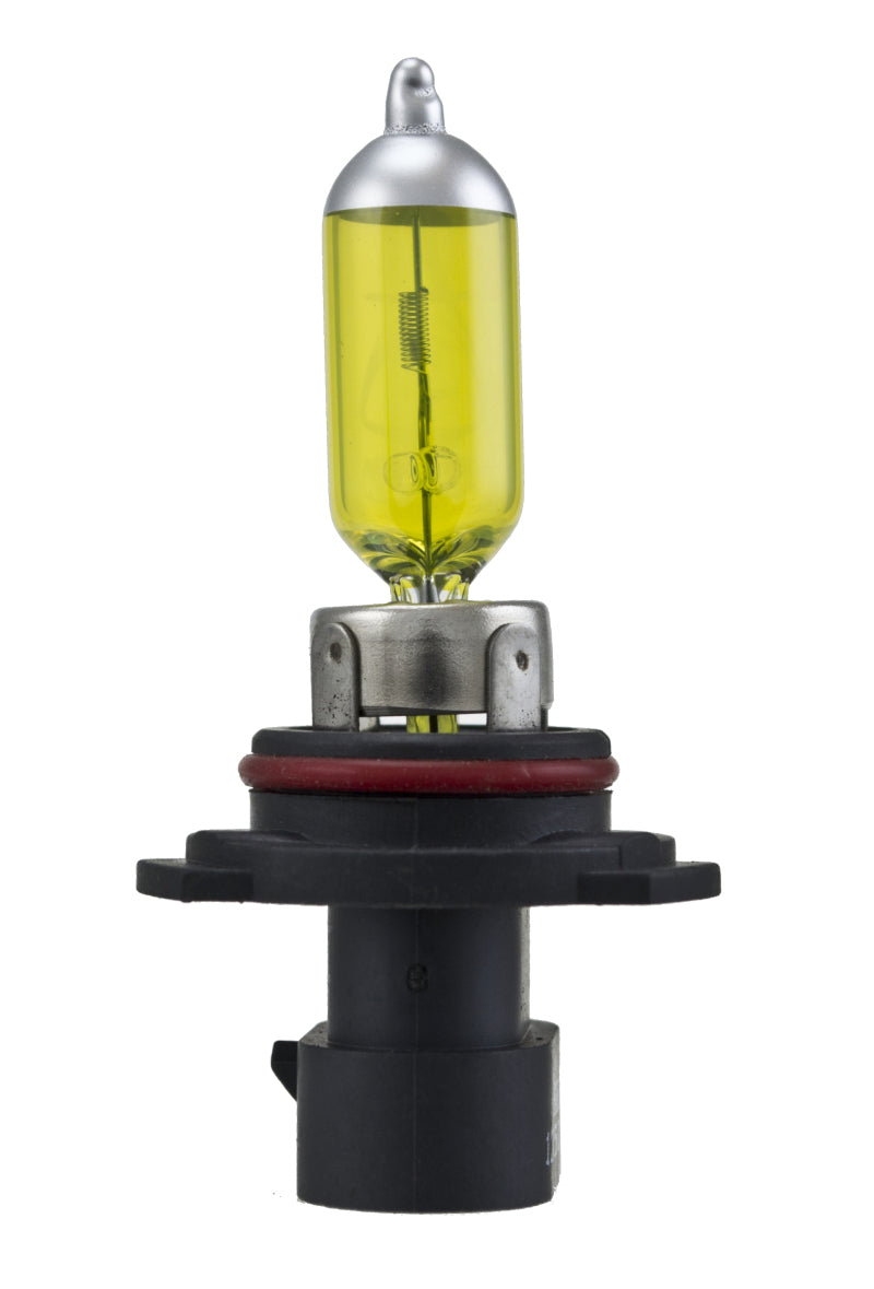 Hella 9006XS 12V 55W XenPure yellow headlight bulbs, pair, with clear glass and yellow-tinted filament for automotive lighting.