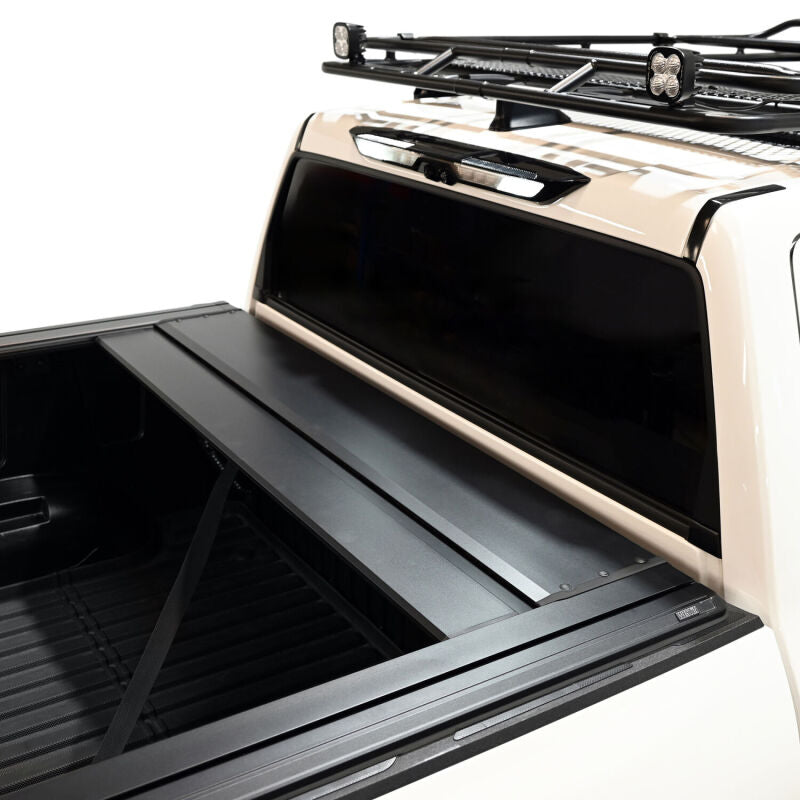 Westin manual retractable tonneau cover in black on a 22-26 Toyota Tundra with 5.5ft bed, roll-up style for truck bed protection