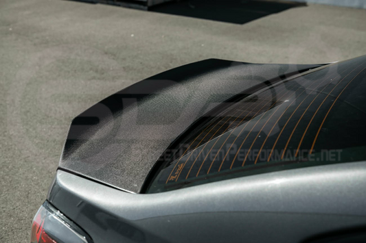 Carbon fiber rear trunk lid with integrated spoiler wing for 2015-2021 Subaru WRX STI, designed for sporty performance.