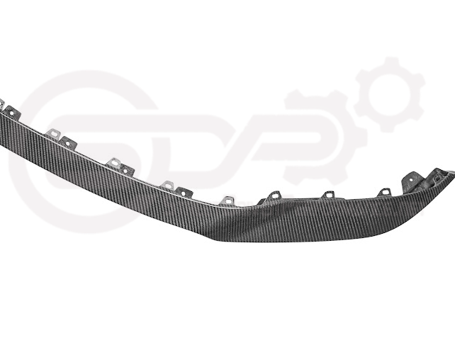 Cadillac CT5-V Blackwing factory OEM style carbon fiber front lip splitter and wheel arches, ground effects on a sleek sedan.