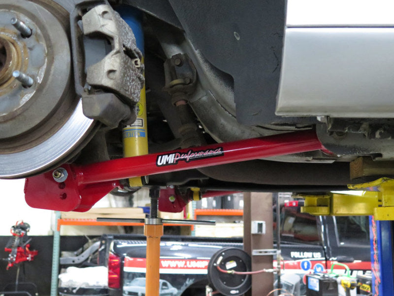 UMI Performance GM F-Body lower control arms and adjustable panhard bar kit installed on a car suspension system.
