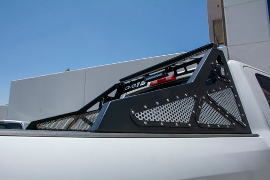 DV8 Offroad chase rack installed on Ram 2500/3500 truck, heavy-duty bolt-on design for offroad protection and cargo support.