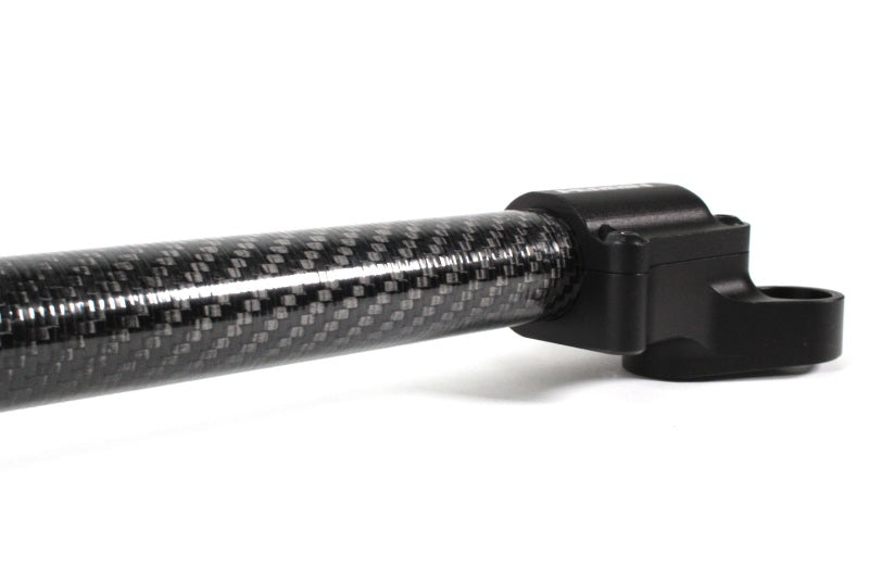 PERRIN carbon fiber front strut brace for Subaru BRZ, Toyota GR86, 86, and Scion FR-S, installed across the front suspension.