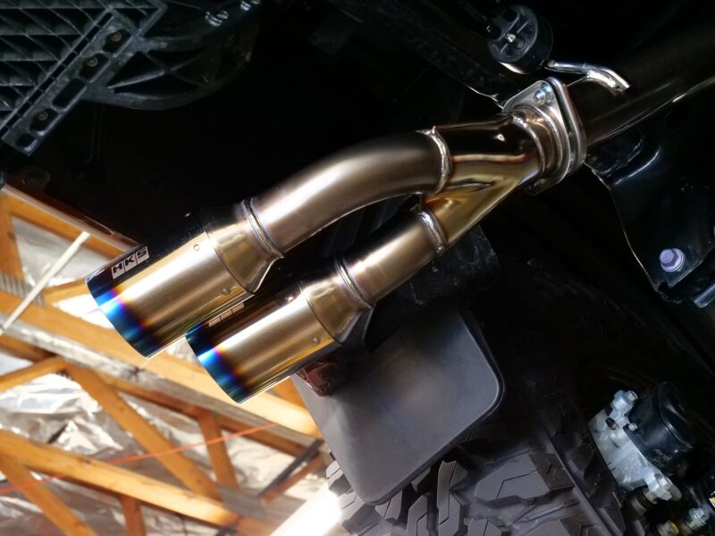 HKS Legamax Trail Master catback exhaust system installed on a 2022 Tundra, showcasing the stainless steel piping and muffler.