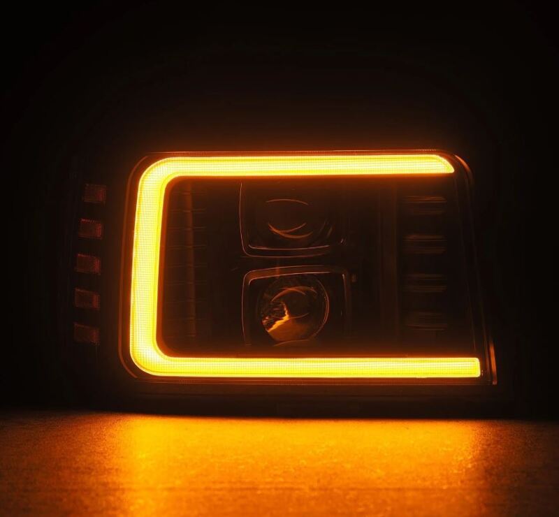 AlphaRex PRO-Series black projector headlights with sequential turn signals and daytime running lights on a Ford F-Series or Bronco.