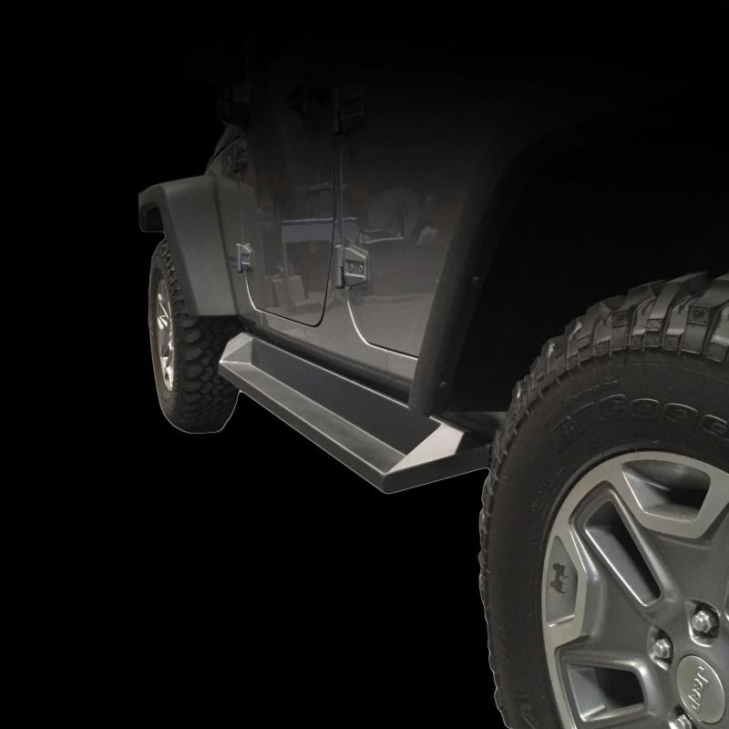 DV8 Offroad Jeep Wrangler JK side steps in matte black, plated steel rock sliders for 4-door models, visible on vehicle side.