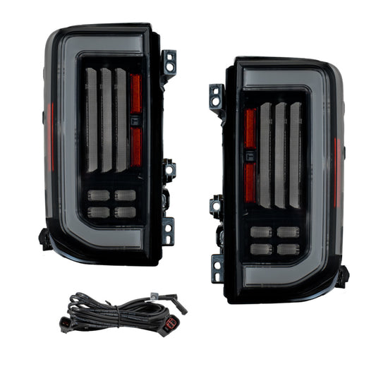 Pair of smoked LED tail lights for 2021-2025 Ford Bronco by FORM Lighting, showing sleek, smoked lens design with integrated LED indicators.