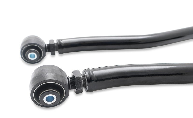 SuperPro lower trailing arm bushings for Jeep Wrangler JK 2007-2018 suspension arm set, showing close-up of the bushings and arms.