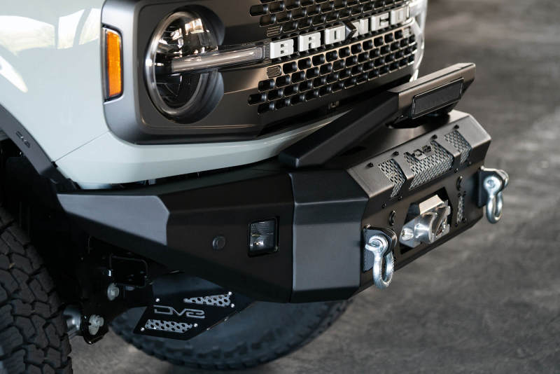 Steel DV8 Offroad bull bar add-on for Ford Bronco bumpers with 13-inch Elite Series light bar, rugged offroad protection.