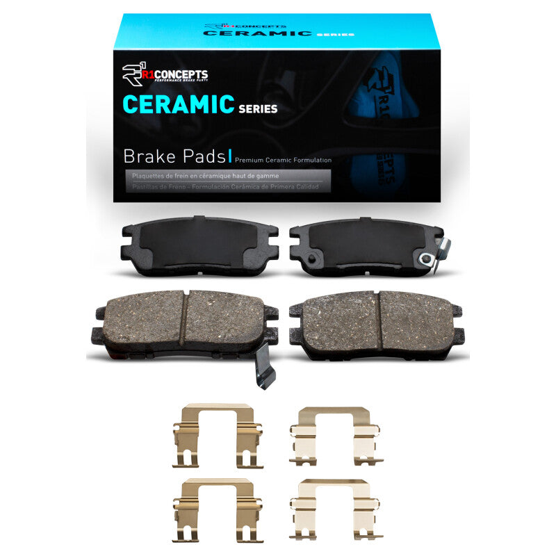 R1 Concepts OE rear ceramic brake pads and hardware kit for Mitsubishi Montero R1 90-00 vehicle, shown with hardware components.