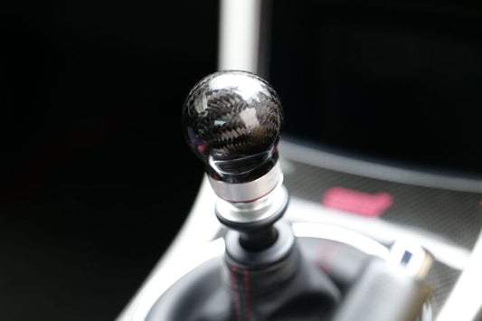 HKS carbon shift knob for 2015-2021 Subaru WRX STI 6-speed manual transmission, showing the sleek black finish and ergonomic design.