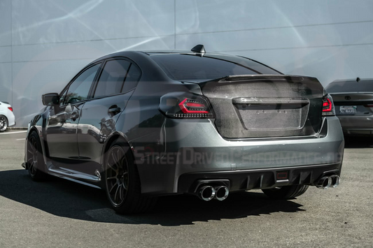 Carbon fiber rear trunk lid with integrated spoiler wing for 2015-2021 Subaru WRX STI, showing detail and sleek design.