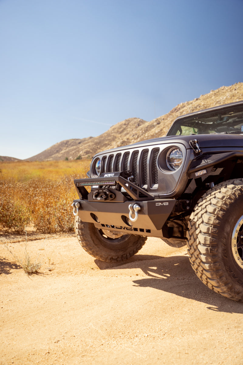 Steel DV8 Offroad Jeep Wrangler/Gladiator FS-25 stubby front bumper with plated bull bar, rugged off-road vehicle accessory