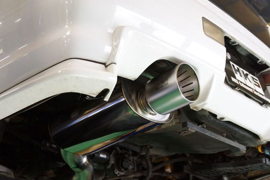 HKS catback super turbo muffler for Nissan Skyline GT-R BNR34 RB26DETT, matte urban edition, visible exhaust system and branding.