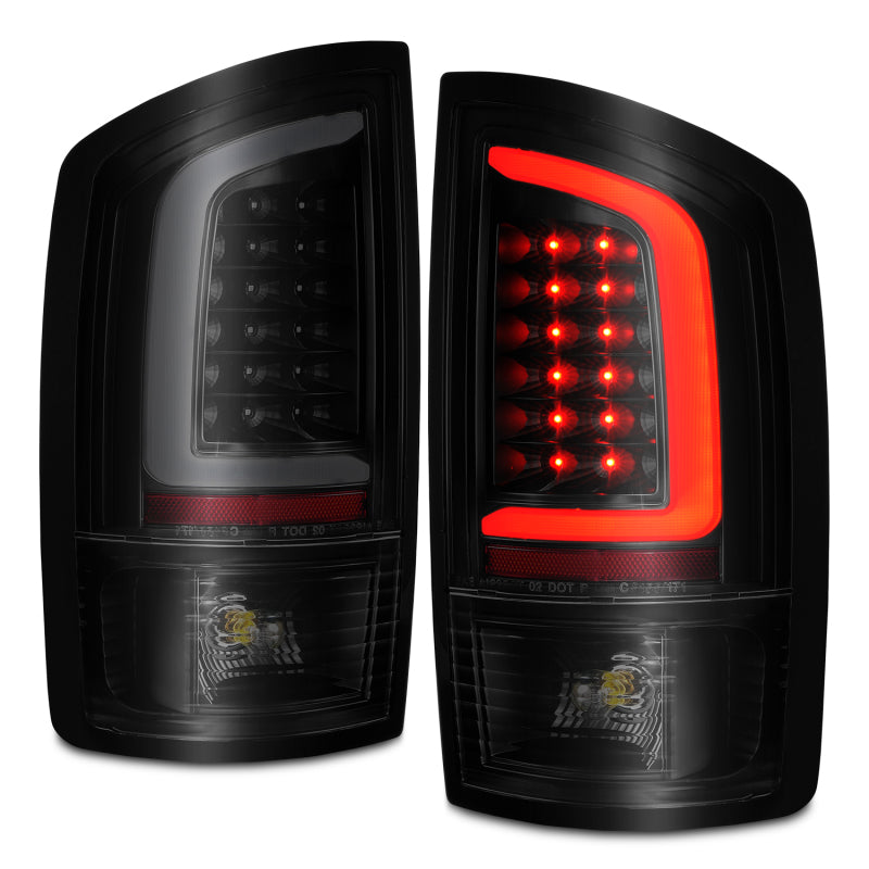 ANZO LED tail lights for Dodge Ram 1500 2002-2006 with black housing and smoke lens, featuring integrated light bar for enhanced visibility.