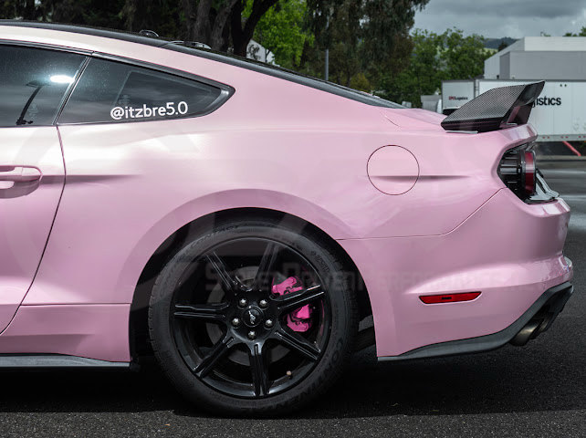 Dark Horse style carbon fiber rear wickerbill spoiler wing on a 2015-2023 Ford Mustang, showing the sleek aerodynamic design.