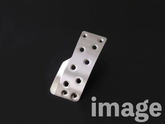 Cusco wide accelerator pedal cover kit for 2023+ Toyota GR Corolla and 2020+ GR Yaris, showing textured metal pedal covers.