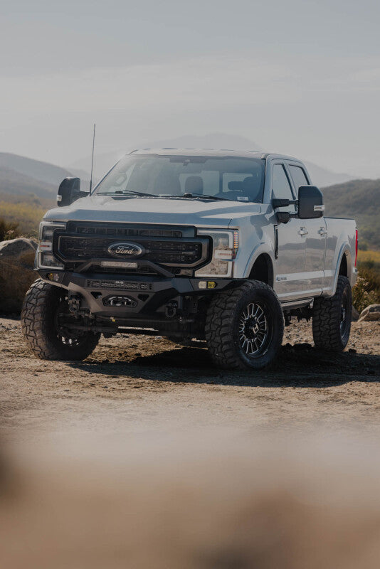 Steel front bumper for Ford Super Duty F-250/F-350 by DV8 Offroad, rugged Spec Series bumper for enhanced durability and off-road performance.