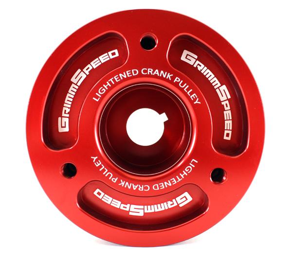 GrimmSpeed Subaru red lightweight crank pulley for underdrive performance, made of durable material, shown on engine.