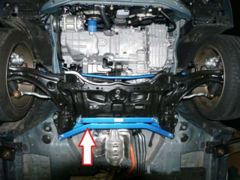 Cusco Lower Arm Bar VER2 front chassis bracing installed on Honda CR-Z ZF1, showing sturdy metal construction and mounting points.