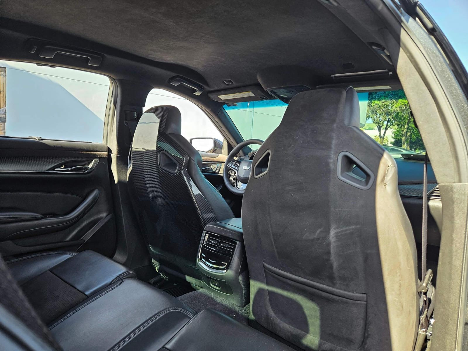 Cadillac ATS-V sedan Recaro carbon fiber seat rear panel cover replacement, driver and passenger side, by Street Driven Performance.