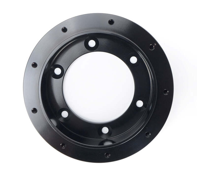NRG 6 to 9 hole steering wheel hub adapter for quick and secure steering wheel installation in vehicles.