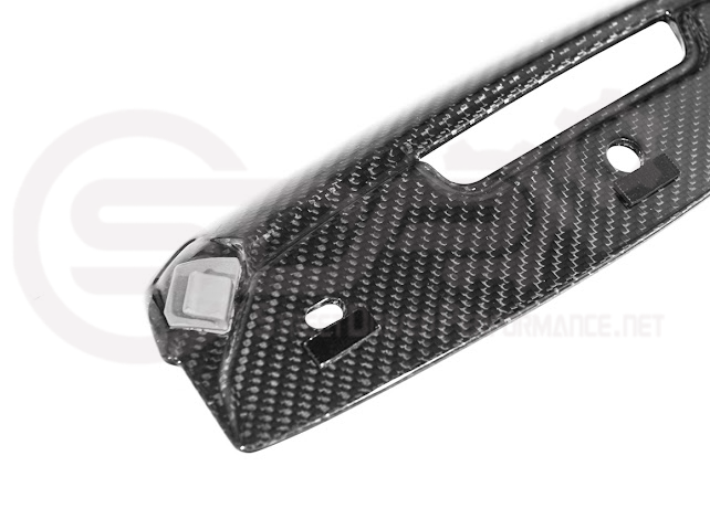 Cadillac CT5-V Blackwing factory OEM style carbon fiber front lip splitter and wheel arches, ground effects for sporty appearance.