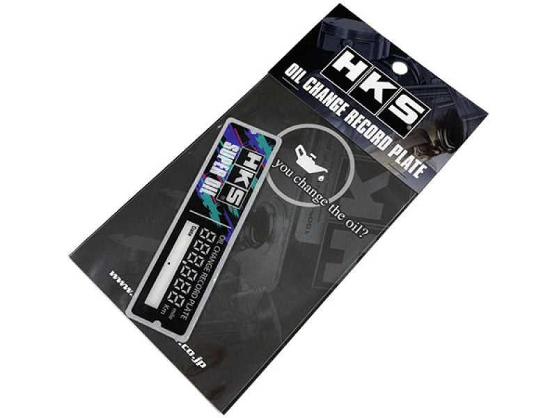 HKS oil change record plate sticker with black and white design, used for tracking oil service history on vehicles.