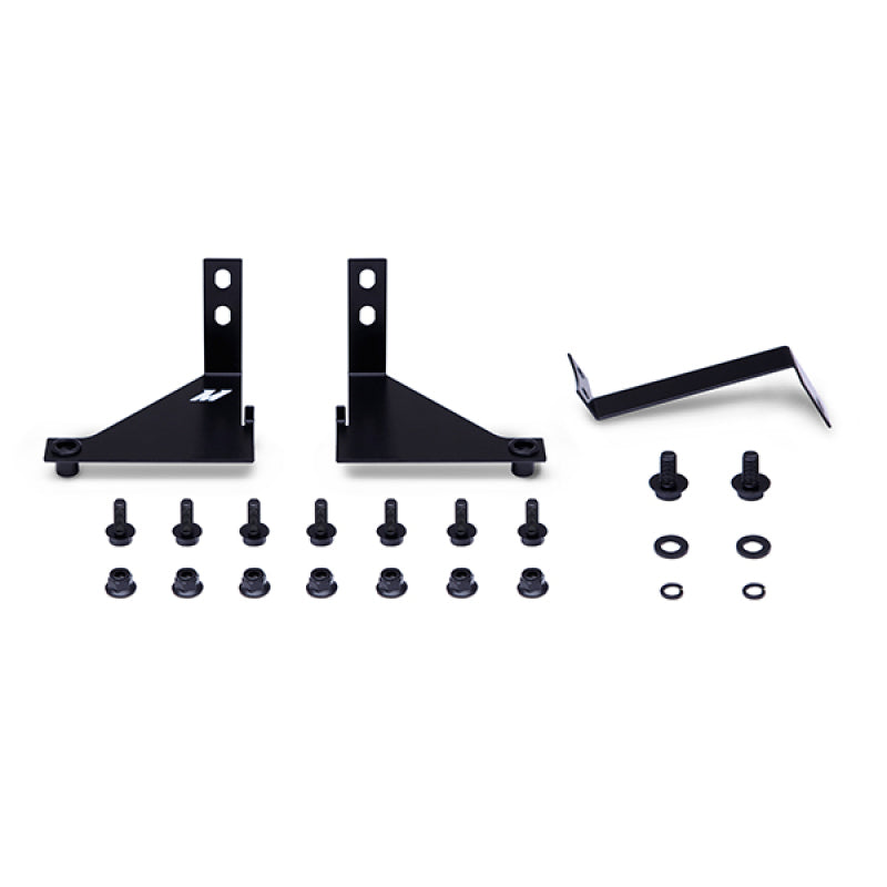 Mishimoto Ford Fiesta ST thermostatic oil cooler kit in silver, featuring a compact oil cooler with hoses and mounting hardware.