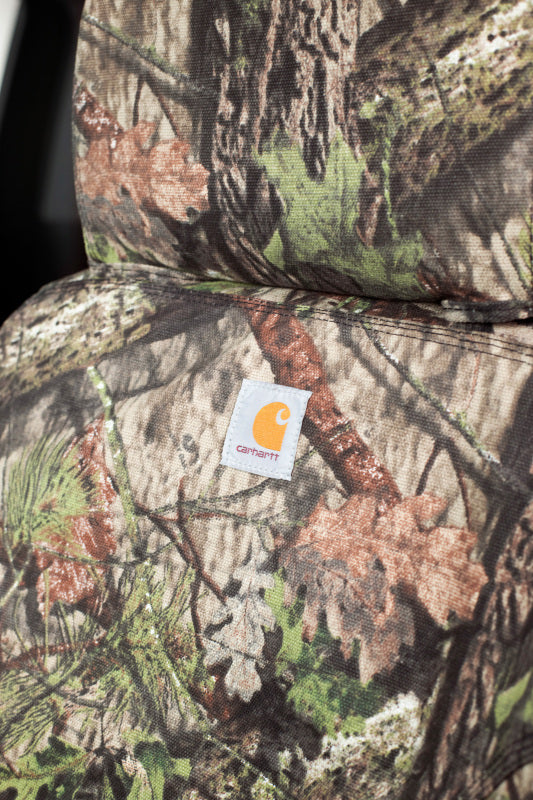 Covercraft Carhartt Camo SeatSaver front seat covers for Dodge Nitro 2007-2009, durable fabric with camouflage pattern.