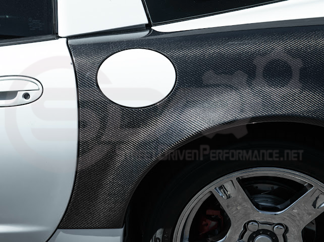 Factory style carbon fiber front and rear widebody fenders for 1997-2004 Chevrolet Corvette C5 hatchback by Street Driven Performance.