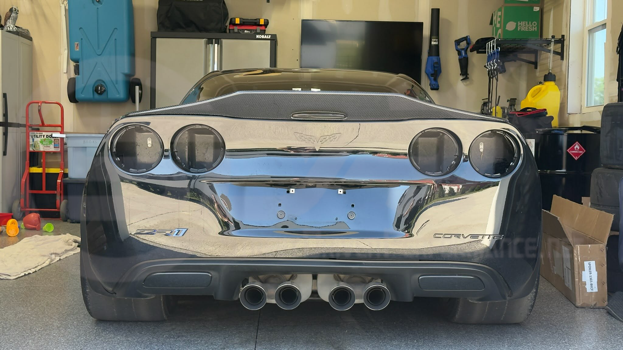 Carbon fiber rear trunk lid wing spoiler for 2005-2013 Chevrolet Corvette C6, designed for aggressive style and performance.