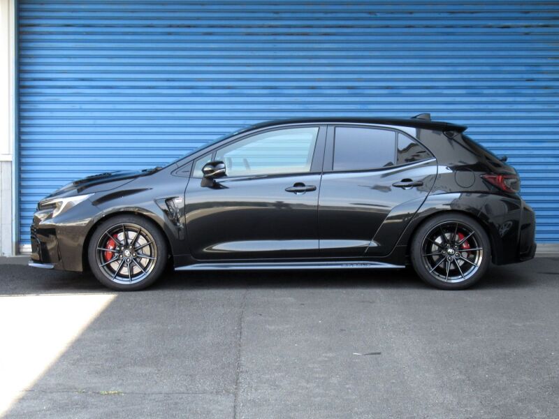 HKS Hipermax MAX S coilover suspension kit installed on a 2023+ Toyota GR Corolla, showing the adjustable shock absorbers and coil springs.