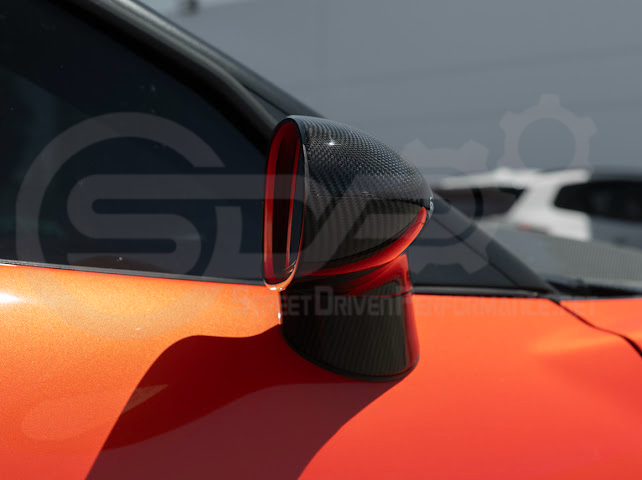 Set of four dry carbon fiber side mirror cap covers for 2005-2013 Chevy Corvette C6, tape-on replacement mirror covers by Street Driven Performance.