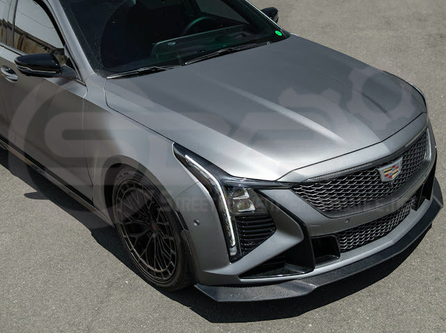 Cadillac CT5-V Blackwing factory OEM style carbon fiber front lip splitter and wheel arches, ground effects, sleek automotive upgrade.