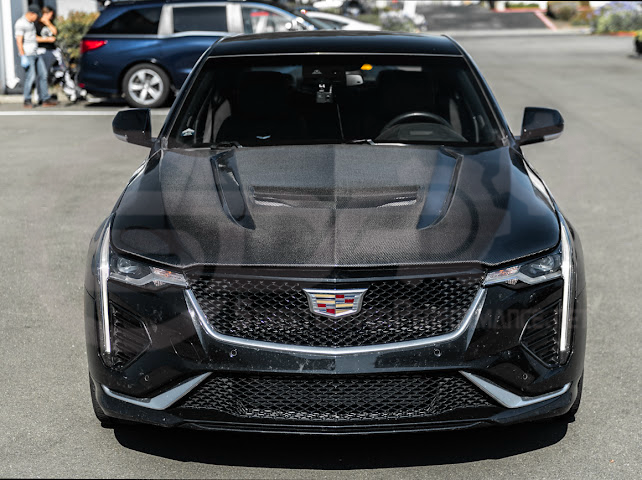 Cadillac CT4-V Black Wing carbon fiber vented front hood with aggressive styling and high-performance design.