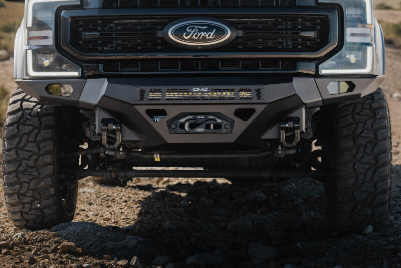 Steel DV8 Offroad front bumper for Ford Super Duty F-250/F-350 2017-2022, rugged off-road vehicle bumper with winch mount.