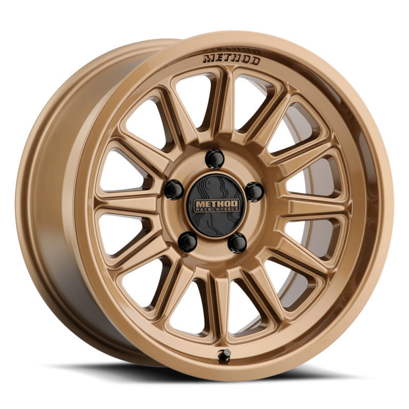 Method MR323 20x9 cast wheel in gloss bronze with 6x5.5 bolt pattern, 12ET offset, 5.44in backspacing, and 106.25mm center bore.