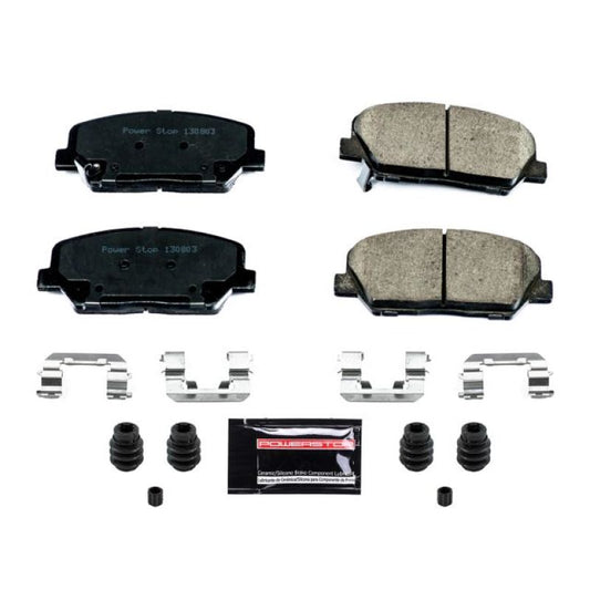PowerStop Z23 Evolution Sport brake pads with hardware installed on front of Hyundai Genesis Coupe 2010-2016, performance brake components.